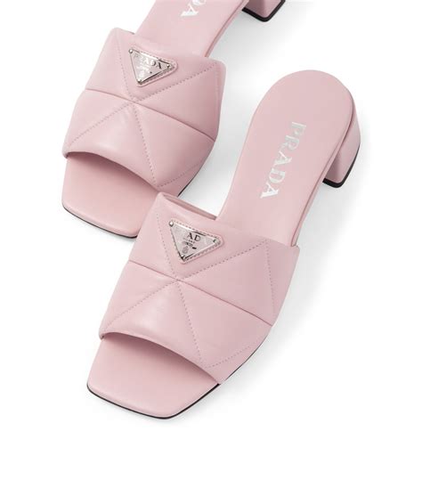 prada quilted leather mules.